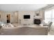 Serene living room featuring neutral decor, a fireplace, and comfortable seating for relaxation at 7067 Hart St, Cumberland, IN 46229