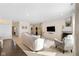 Comfortable living room featuring neutral walls, plush seating, and seamless flow into other rooms at 7067 Hart St, Cumberland, IN 46229