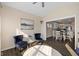 Bright sitting room features plush chairs and transitions into the kitchen and dining area at 7067 Hart St, Cumberland, IN 46229