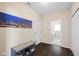 This mud room leads to a laundry room and features a shoe bench and closet at 7067 Hart St, Cumberland, IN 46229