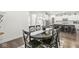 Open concept dining area leading to the kitchen with stainless appliances and a kitchen island at 7092 Cherry Creek Blvd, Carmel, IN 46033
