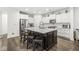 Bright kitchen featuring white cabinets, stainless appliances, and a large kitchen island at 7092 Cherry Creek Blvd, Carmel, IN 46033