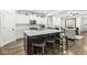 Modern kitchen featuring white cabinets, stainless appliances, and granite countertops at 7092 Cherry Creek Blvd, Carmel, IN 46033