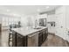Kitchen featuring white cabinets, stainless appliances, and a large island with seating at 7092 Cherry Creek Blvd, Carmel, IN 46033