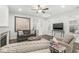 Bright living room with dark hardwood floors, a fireplace and view of dining area at 7092 Cherry Creek Blvd, Carmel, IN 46033