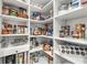 Spacious pantry with shelves and cabinets for ample storage of household items at 7092 Cherry Creek Blvd, Carmel, IN 46033