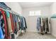 Walk-in closet with ample hanging space and shelving for optimal organization at 7092 Cherry Creek Blvd, Carmel, IN 46033