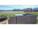 Backyard patio seating area with new patio furniture overlooking the pond at 7195 E Rising Sun S Cir, Camby, IN 46113