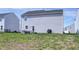 Backyard featuring an outdoor seating area and newly installed sod at 7195 E Rising Sun S Cir, Camby, IN 46113