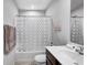 Bright bathroom with a decorative shower curtain, modern vanity, and a sign that says 'Time to Relax' at 7195 E Rising Sun S Cir, Camby, IN 46113