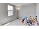 Bright bedroom bathed in sunlight, filled with an assortment of plush Squishmallow toys at 7195 E Rising Sun S Cir, Camby, IN 46113