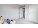 Well-lit bedroom with plush toys and an open closet, offering ample storage and comfort at 7195 E Rising Sun S Cir, Camby, IN 46113