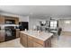 Functional kitchen featuring an island with bar seating and an open layout perfect for entertaining at 7195 E Rising Sun S Cir, Camby, IN 46113