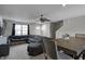 Spacious living room seamlessly connects to dining area, enhancing flow and openness for entertaining at 7195 E Rising Sun S Cir, Camby, IN 46113