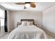 Inviting primary bedroom featuring a cozy bed, stylish nightstands, and a ceiling fan for added comfort at 7195 E Rising Sun S Cir, Camby, IN 46113