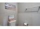 Powder room featuring wall art, toilet, and chrome fixtures at 7195 E Rising Sun S Cir, Camby, IN 46113