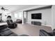Finished basement showcasing a comfortable living area with a large TV and neutral color palette at 7450 Cassilly Ct, Indianapolis, IN 46278