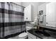Charming full bathroom with black granite countertops and custom cabinets at 7450 Cassilly Ct, Indianapolis, IN 46278