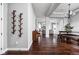 Spacious foyer with wood floors, coat rack, and views into the living and dining areas at 7450 Cassilly Ct, Indianapolis, IN 46278