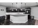 Kitchen island with bar seating and overhead pendant lights at 7450 Cassilly Ct, Indianapolis, IN 46278