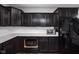 Kitchen with black appliances and custom cabinets at 7450 Cassilly Ct, Indianapolis, IN 46278