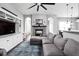 Spacious living room with fireplace, custom built-ins, and large sectional sofa, great for entertaining at 7450 Cassilly Ct, Indianapolis, IN 46278