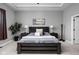 Well-lit main bedroom featuring a comfortable bed, nightstands, and stylish decor for relaxation at 7450 Cassilly Ct, Indianapolis, IN 46278