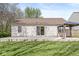 A lovely backyard showing the home's patio with a lawn and an attractive gazebo at 7841 Whitaker Farms Ln, Indianapolis, IN 46237