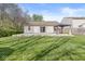 A home's backyard features a patio with gazebo and a lawn with attractive shade at 7841 Whitaker Farms Ln, Indianapolis, IN 46237