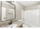 Bathroom featuring a vanity sink, mirror, and a shower-tub combination at 7841 Whitaker Farms Ln, Indianapolis, IN 46237