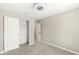 This bedroom features neutral carpet and paint, closet, and overhead lighting at 7841 Whitaker Farms Ln, Indianapolis, IN 46237