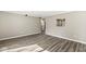 A bright living room featuring durable floors, neutral paint, and ample natural light at 7841 Whitaker Farms Ln, Indianapolis, IN 46237