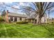 Spacious backyard with mature trees and swing set at 7845 Allisonville Rd, Indianapolis, IN 46250