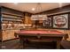 Finished basement boasts a custom wet bar, pool table, and sports-themed decor at 7845 Allisonville Rd, Indianapolis, IN 46250