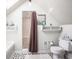 This bathroom features tile flooring, a shower, a toilet, a sink, and storage space at 7845 Allisonville Rd, Indianapolis, IN 46250