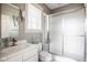 Clean bathroom featuring a white vanity, mirrored medicine cabinet, and glass-enclosed shower at 7845 Allisonville Rd, Indianapolis, IN 46250