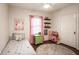 This bedroom features a small bed, hardwood floors, and a fuzzy rug at 7845 Allisonville Rd, Indianapolis, IN 46250