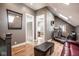 Finished bonus room with skylights, hardwood flooring, and exercise equipment at 7845 Allisonville Rd, Indianapolis, IN 46250