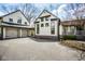 Exterior view of detached three car garage and home featuring beautiful curb appeal at 7845 Allisonville Rd, Indianapolis, IN 46250