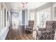 Bright entryway featuring stylish armchairs, large windows, and an open floor plan at 7845 Allisonville Rd, Indianapolis, IN 46250
