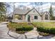 Charming home with a manicured lawn, flower beds, and a white picket fence offering wonderful curb appeal at 7845 Allisonville Rd, Indianapolis, IN 46250