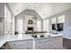 Open-concept living area with fireplace, large windows, and a view of the gourmet kitchen at 7845 Allisonville Rd, Indianapolis, IN 46250