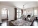 Inviting living room featuring a cozy fireplace, hardwood floors, and abundant natural light at 7845 Allisonville Rd, Indianapolis, IN 46250