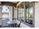 Cozy front porch area with chess table and chairs at 7845 Allisonville Rd, Indianapolis, IN 46250
