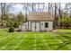Well-maintained storage shed with double doors and charming details at 7845 Allisonville Rd, Indianapolis, IN 46250