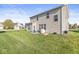 Spacious backyard featuring a well-maintained lawn and an outdoor seating area for relaxation at 7901 Apalachee Dr, Indianapolis, IN 46217