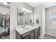 Elegant bathroom with double vanity, ample lighting, and a serene color palette, creating a spa-like atmosphere at 7901 Apalachee Dr, Indianapolis, IN 46217