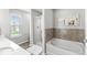 Modern bathroom with a separate shower and soaking tub, offering a luxurious and relaxing spa-like experience at 7901 Apalachee Dr, Indianapolis, IN 46217