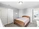 Bright bedroom featuring neutral walls, a closet, and plush carpeting throughout at 7901 Apalachee Dr, Indianapolis, IN 46217