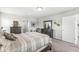 Inviting bedroom with dark wood furniture, soft lighting, and a view into the living area, creating a relaxing ambiance at 7901 Apalachee Dr, Indianapolis, IN 46217